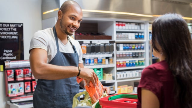 Cashier working at supermarket